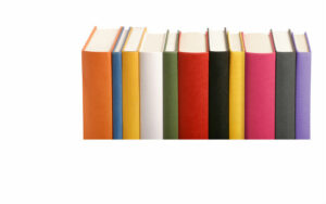 Different coloured books in a row