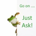 A frog peeking round a card with "Go on ...just ask!" written on it.