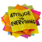 "Attitude is everything" written on pile of post it notes