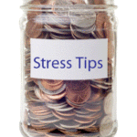 Coin filled jam jar with stress tips label