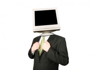 Man wearing suit with computer monitor instead of head